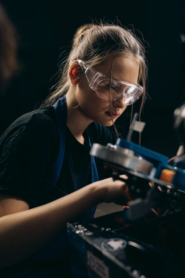 pexels-mikhail-nilov-9241713 A young woman wearing safety glasses